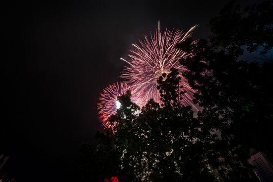 Figure out the wind direction and get upwind of the fireworks so that your shots aren't obscured by smoke blowing toward you.