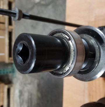 Use a rubber mallet to seat the bearing on the shaft.