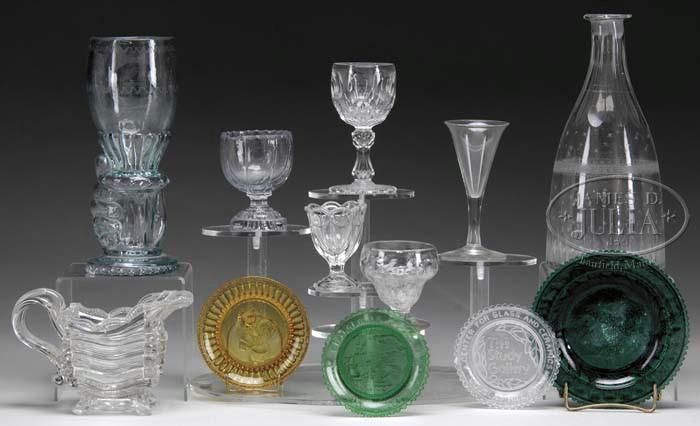 00 Lot 2078 TWELVE PIECES OF GLASS Lot consists of three cup plates, one Sandwich glass museum eagle toddy plate, an early pressed flint creamer (badly cracked), a blown bonnet salt (chipped rim),