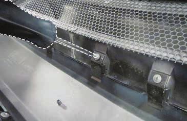 Insert the grilles from the front of the bumper then loosely install clips using the screws provided in
