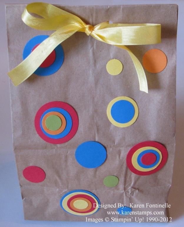 Decorate a Simple Lunch Sack You can do many things with a simple lunch sack! Stamp or decorate the outside of the bag. On this bag, simply punching circles out of paper scraps makes a fun design!