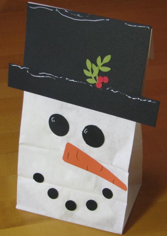 Make a Snowman Gift Bag Make a Gift Card Holder with an Envelope Using a white lunch sack, fold over the top edge to the back.