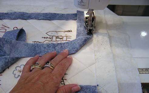 9. Continue sewing the binding to the quilt until up are 8 from the beginning end of the binding.