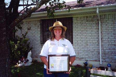 2003: Debra Justice with her AMA District Service Award from District VIII Vice President Dr. Sandy Frank.