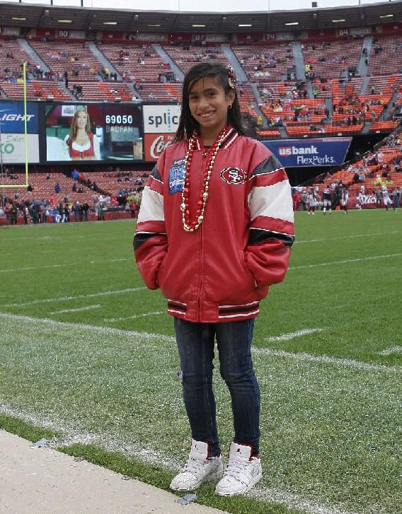 I was so excited; I could not believe I was going to be on the same field as all the 49ers players. I was jumping up and down! Did the 49ers win? We played the Arizona Cardinals and yes we won!