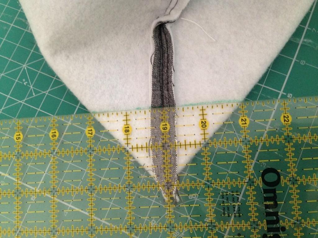 Stitch along this line. Cut off the extra corner.