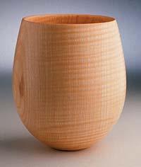 Ray emphasizes his personal approach to turning wood focusing on elegant simplicity and purity of form.