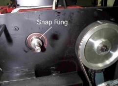 12) Use snap ring pliers to remove the Snap Ring from the Arbor Shaft (Figure 7). Do not over extend or bend the Snap Ring.