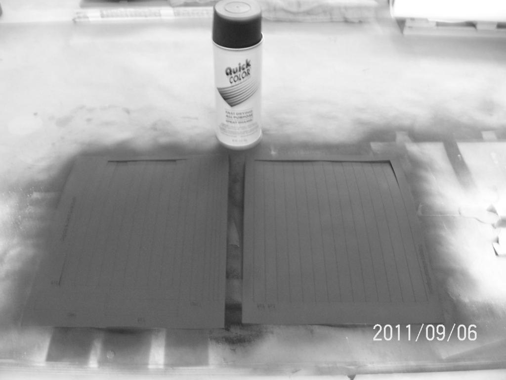 While building dries locate adhesive roof material and paint. I found 99 cent a can paint from HomeDepot works great. It s flat black enamel, spray 3-4 light coats till even cover.