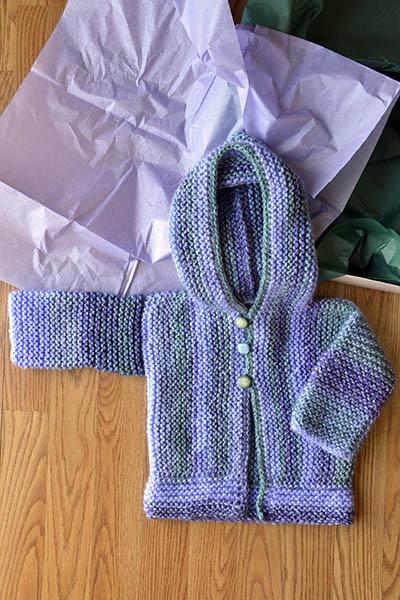 Cozy Cardi sizes 3-6 mos, 9-12 mos, 18-24 mos, 3-4 yrs & 5-6 yrs Free Size 10 32 circular needle Major yarn by Universal (1-2 skeins, depending on size) Knitting Survival Kit, tapestry needle, size J