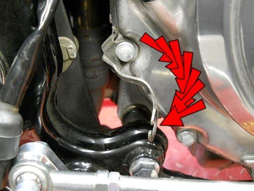 Use pliers to bend the brake light switch mount as shown.