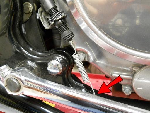 Unhook the brake switch spring from the stock