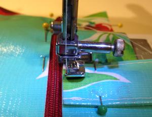 Step 16 Topstitch around the zipper window, which will also sew the strap into place.