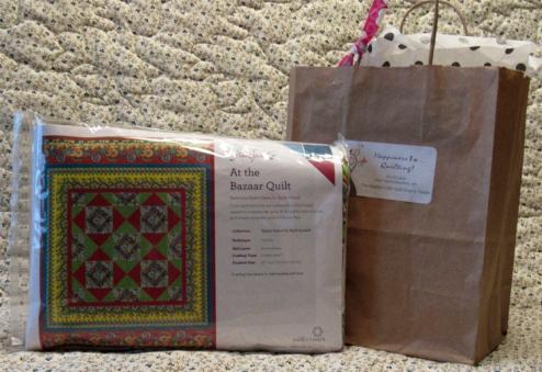 A Free Spirit quilt kit called At The Bazaar, a 42 by 52 quilt with a beautiful array of