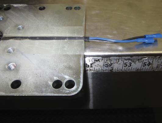 Flip over the Drive Mounting Plate and you may see some tape holding the wires in place (SEE FIGURE 5-C).