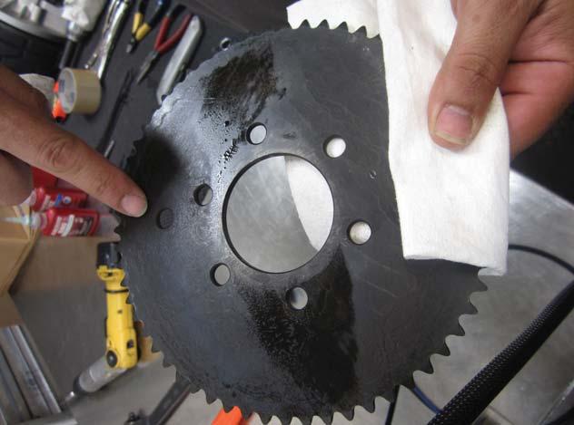 Take the sprocket and make sure that it is clean of oil or