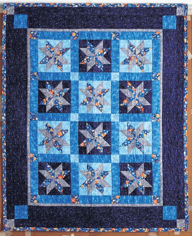 space ranger Inspire a budding astronaut with this quilt made from space-theme fabrics.