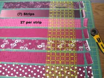 From your Simply Colorful 2 Junior Jelly Roll Strips cut (189) 1 1/2" x 2 1/2" rectangles I found the easiest way to cut my print rectangles was to layout 7 jelly roll strips on my mat,