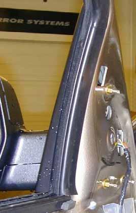 Route Signal mirror wire harness through mirror mount hole and mount mirror housing to the door frame by securing all (4) posts.