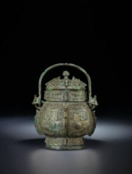Lot 2172 AN IMPORTANT AND VERY RAREARCHAIC BRONZE WINE VESSEL, YOU LATE SHANG DYNASTY, 12th-11th CENTURY BC 12 ¾ in. (32.3 cm.