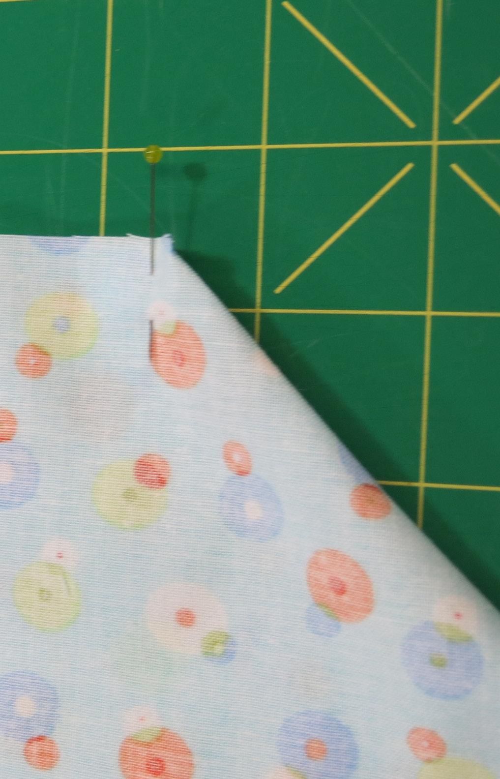 You will be using the full width of the fabric, including the selvage edges. 2.