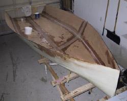 Once the hull outer shell has been fiber-glassed, it s time to remove the hull from the mold. You may use the building bench with the formers removed, to place the hull up righted.