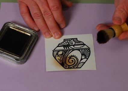 Stamp the image onto cream cardstock and emboss with opaque