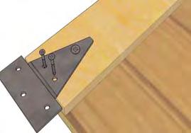Use a shingle to shim the door at bottom to help position door