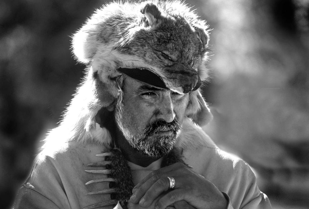 The Mountain Men Mountain man with bobcat cap.