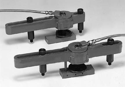The shuttle vise has a two-sided hydraulic system that allows it to clamp and feed irregular pieces without binding.