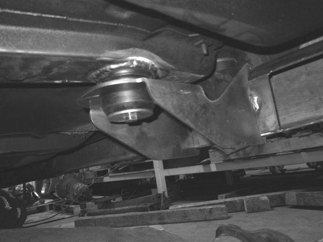 Attach body brace to threaded insert with new body mount,sleeve,washer and 3/8 X 2-1/2 bolt as shown below.
