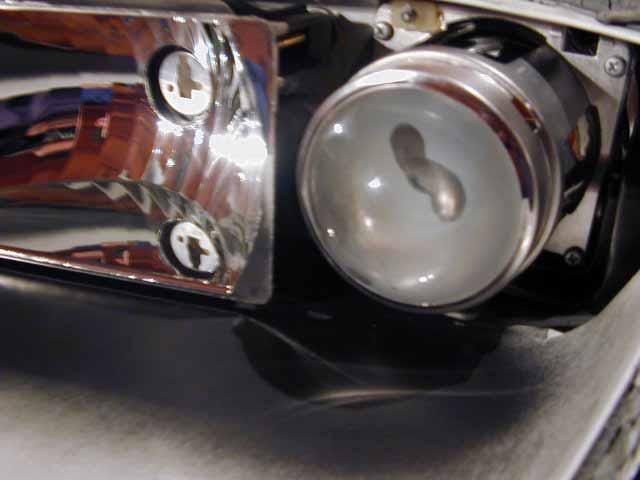 Headlight Disassembly There are a few reasons you might want to disassemble a Z headlight, perhaps to chrome or paint the dark grey interior piece, or more likely just to clean the inside, which