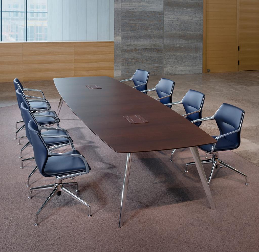 The collection consists of a cantilever chair, conference chair, easy chair, high-back lounge, ottoman and tables.