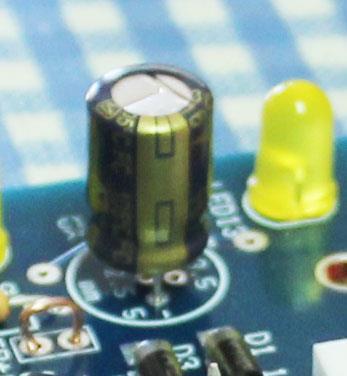 9 Now insert the large capacitor, C1, into the board. This capacitor has polarity and must be oriented properly.