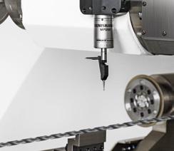 The rotary dressing device with diamond rollers regenerates profile wheels by dressing the profiles.