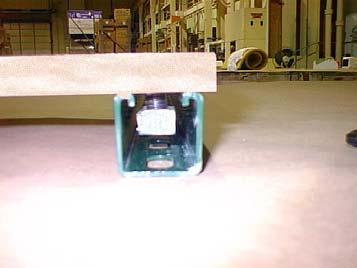 ATTACHING THE CENTER PANEL TO THE VERTICAL CHANNEL (Figure 2): 1. Lay the two upright assemblies on the floor with the open side facing up and the wheels on the right side (see figure 2).