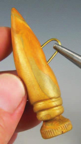 Use pliers (preferably round-nosed) to bend the wire in half, like a U.