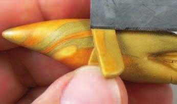 Use a blade to cut a thin, long strip of clay.