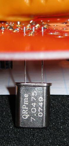Then I insert the socket into the board and rest the board on the resistor like a leg and solder 1 pin with your two free hands.
