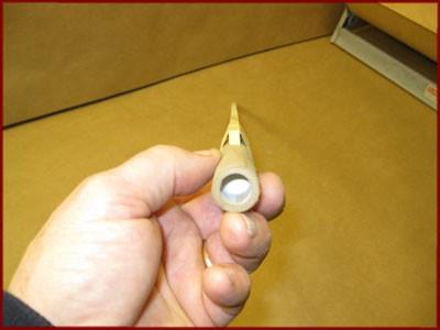 Two Masking-Tape Bands Holding Stick onto Motor Sight down the motor and stick, and twist the stick side-to-side to align it.