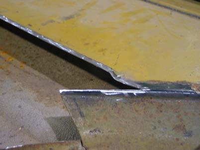 Also remove the paint around the areas where the replacement panel will be welded as shown. 6.
