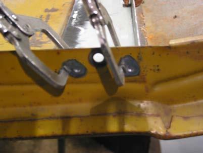 11. We need to re-create the two spot welds at the front panel flange that were drilled out.