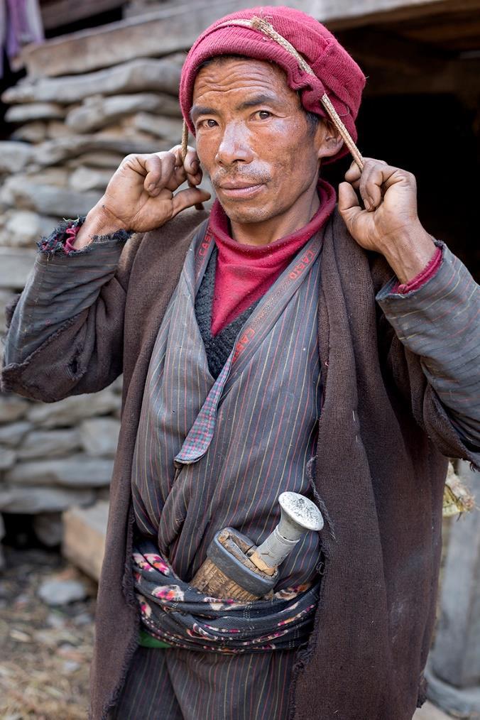 Man with Khukuri Tamangs are Lama (Tibetan) Buddhists. Their communities in the Himalayas share a border with Tibet.