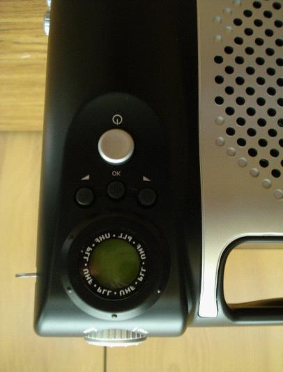 On this speaker, the channel is changed on the front of the unit. This model does not utilize a dial to change the channel.