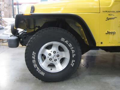 remove/loosen the rear wheel well skirting.