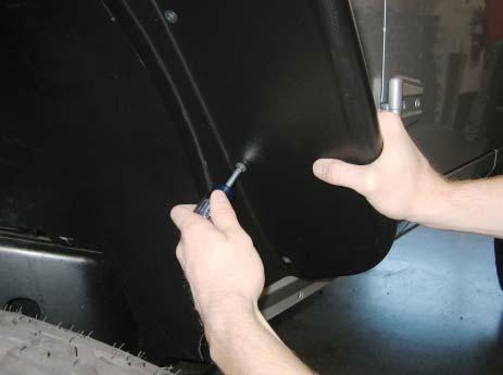 vehicle surface. Slide the tool along the edge trim while pressing it in toward the vehicle surface.
