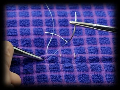 Wrap the needle end of the suture material once or twice (as