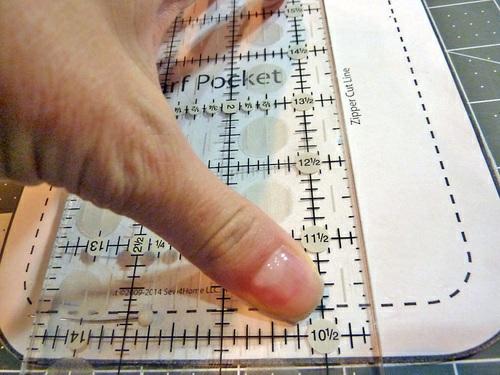 as when you cut out the pocket. 4. Pin the pattern in place and align your ruler along the zipper cut line. 5.