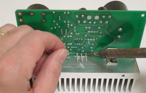 Inspect your work from both the top and the bottom of the board to make sure there are no solder bridges between the leads. Attach the Power Supply Ground Wire 1.