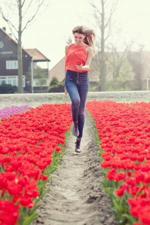 Notice how the red of the flowers complements the top the model is wearing and supports the joyous